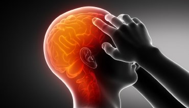Illustration of a person experiencing migraine pain, with a highlighted brain area indicating discomfort, reflecting the chiropractic focus on migraine relief and neurological care.