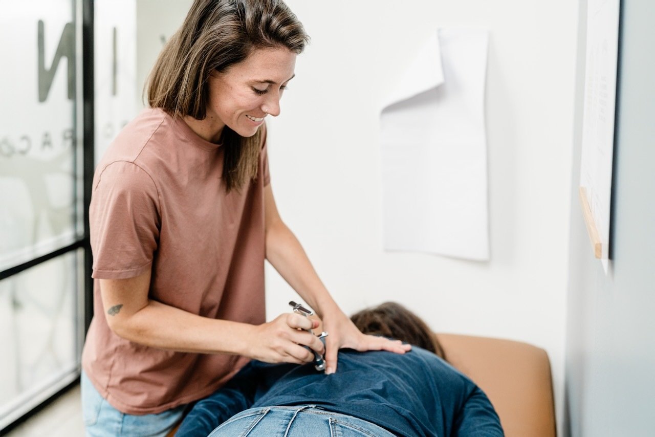 Chiropractor using Torque Release Technique on patient in Bellingham chiropractic clinic, emphasizing patient-focused care and spinal health.