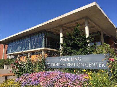 Wade King Student Recreation Center in Bellingham, featuring modern architecture and vibrant landscaping.